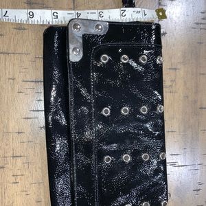 Black patent leather like clutch with grommets